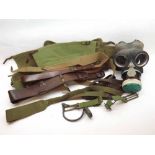 A Vintage Gas Mask and various webbing and belts etc