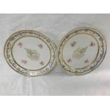 A pair of Chinese/Samson Armorial Plates, decorated with flowers and gilded geometric designs,