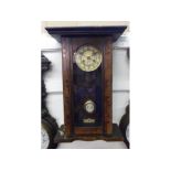 An early 20th Century Walnut Vienna type Wall Clock, the overhanging cornice over a glazed door to a