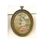 An oval framed late 18th/early 19th Century Silk Work Picture of a girl with bird, frame 9 ¼” high