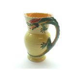 A Burleigh Ware Novelty Jug, the handle formed as a dragon, the body decorated in yellow with ribbed