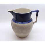 A 19th Century Turner Blue and White Jug decorated with raised design of hunting scene, 8 ½” high