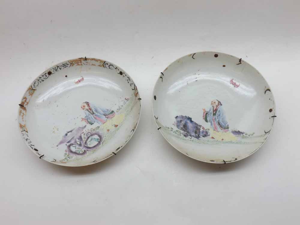 A pair of 18th Century Chinese Bowls of circular form, the centres painted in colours with scenes of