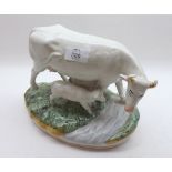 A pair of Staffordshire Models of Cows and Calf, each standing beside a stream on a moss-encrusted