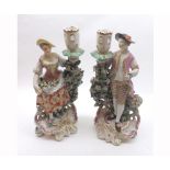 Pair of Derby Porcelain Candlestick figures of a flower seller and his female companion, each