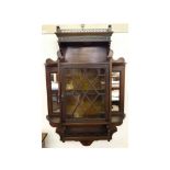 An Edwardian Mahogany Wall Mounted Cabinet, with galleried top, side mirrored sections and central