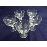 A set of five Regency style large Wine Glasses with funnel bowls, single knopped stems and spreading