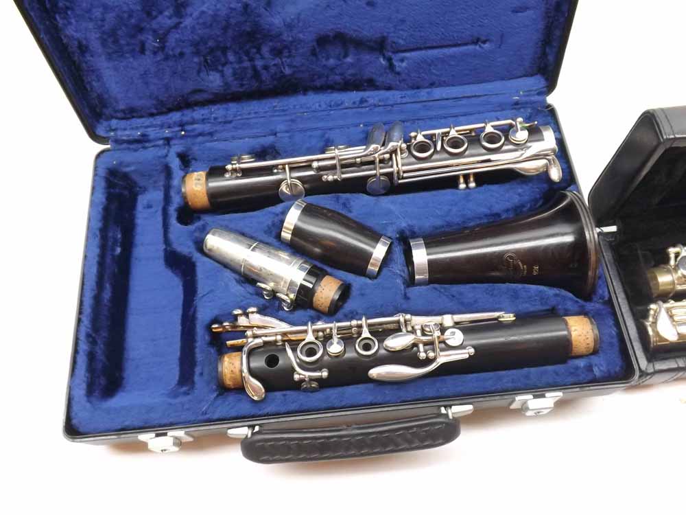 A Boosey & Hawkes Clarinet of ebony construction with silver plated or chromium fittings “