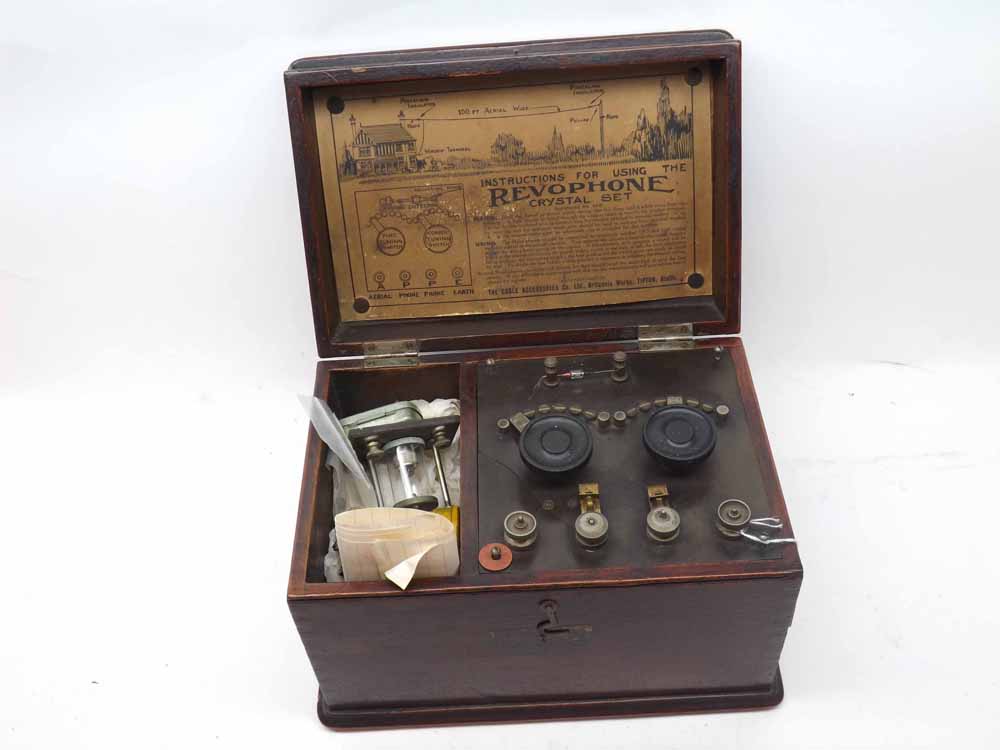 A Revophone Crystal Receiver Set (A/F), in a wooden case, inner lid applied with label (The Cable