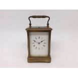 A late 19th Century French lacquered Brass repeating Carriage Clock, unsigned, the silvered lever