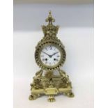 A late 19th Century cast Brass Mantel Clock, the drum shaped case surmounted by a crown with central