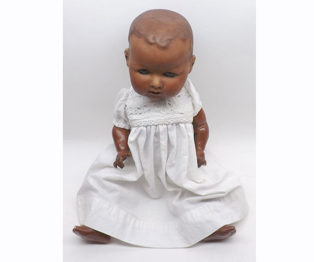 Armand Marcel later brown painted Bisque socket head baby Doll