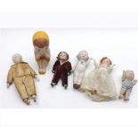 Six assorted Vintage Dolls to include: two all Bisque Dolls House type Dolls; sitting Kewpie type