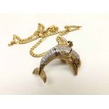 An unusual hallmarked 9ct Gold and white stone set articulated Dolphin Pendant, suspended on a