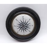 Unusual ceramic lid decorated in the form of a compass in circular wooden frame, 7" diameter in