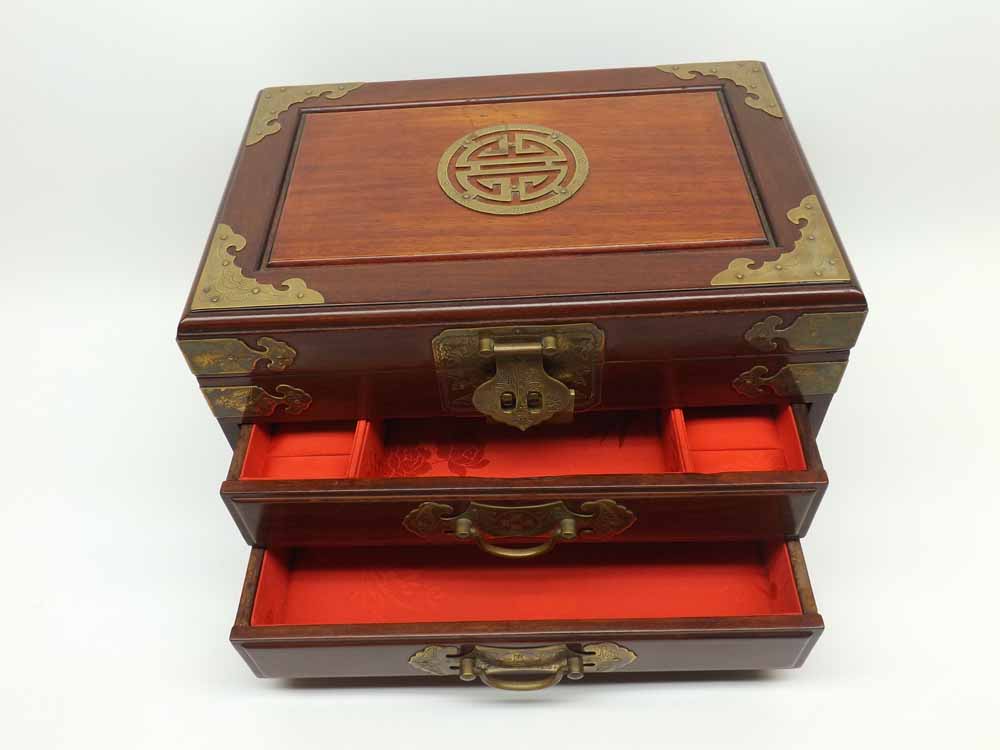 A decorative 20th Century Chinese Hardwood and Brass Mounted Table Top Vanity Chest, lifting lid and