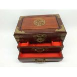 A decorative 20th Century Chinese Hardwood and Brass Mounted Table Top Vanity Chest, lifting lid and