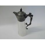 A late Victorian Cut Glass Claret Jug with pewter mounts, mask pourer, 30cm tall