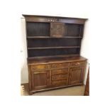 Early 19th Century Oak Dresser, the base with six short drawers and two panelled doors raised on