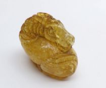 A small Chinese Amber Carving in the manner of a Tang Horse, 2" long