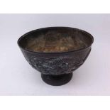 An Oriental Antimony Bowl of pedestal form, embossed with dragons and smoke clouds, 7 1/2" diameter