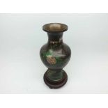 A Cloisonn Baluster Vase (base drilled and rim dented etc), on a hardwood stand (A/F) 9" high