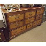 An 18th Century Oak Dresser Base, moulded edge over nine fitted drawers on ogee bracket feet, 60"