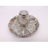 A good quality Victorian circular Inkstand, the tray-formed base with foliate engraved segmented