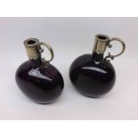 A pair of Victorian oval Dark Purple Spirit Decanters, fitted with silver plated mounts and looped