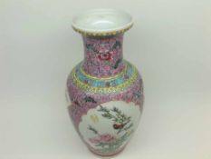 A Chinese Baluster Vase of tapering form, painted predominantly in famille rose and verte with