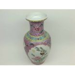 A Chinese Baluster Vase of tapering form, painted predominantly in famille rose and verte with