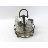 An early 20th Century Electroplated Oval Cruet Stand holding five cut glass bottles, 17cm wide