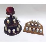 A collection of fifteen modern Royal Crown Derby Thimbles, together with matching stand and pin-