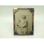 An Edwardian plain rectangular Silver Mounted Photograph Frame with card cut decoration and raised