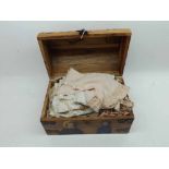 A small wooden Trunk containing a quantity of assorted vintage and hand-made doll's clothing