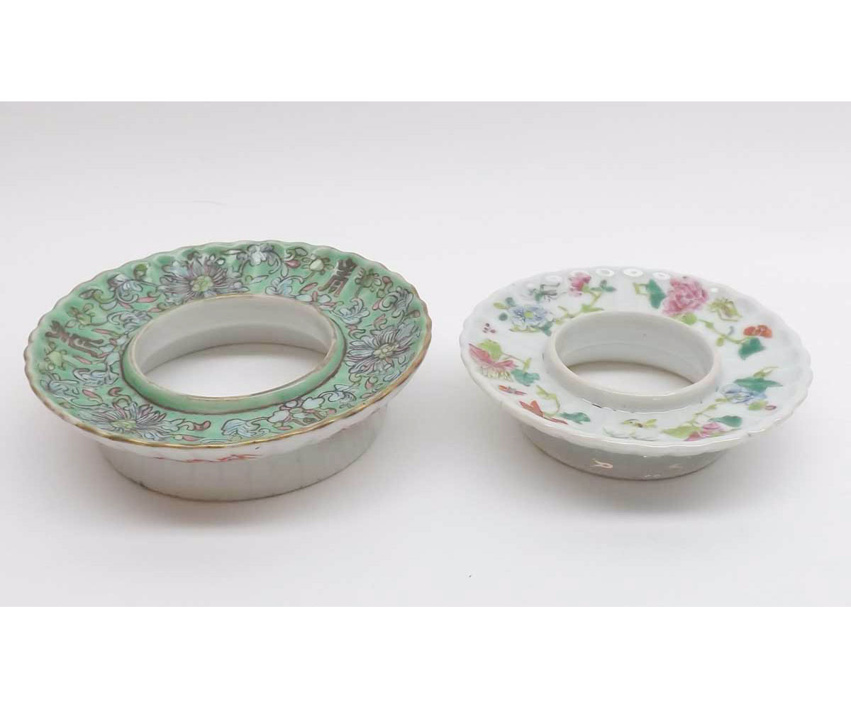 Two Oriental Circular Stands, one painted in famille rose and the other in famille rose, pale blue