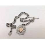 A late Victorian heavy graduated curb link Silver Watch Chain with T-bar snap and medallion, 32cms