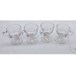 A set of four 19th Century Clear Glass Custard Cups of typical form with looped handles, 3 1/4" high