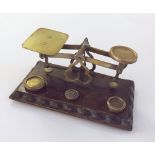 Vintage Brass Letter Scales, raised on a wooden base complete with three small Brass weights, 7"