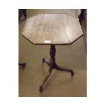 A Mahogany Pedestal Table, octagonal top and ring turned column on a tripod base, 19" wide