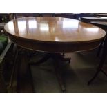 A reproduction Mahogany Twin Pedestal Extending Dining Table, inlaid with ebonised stringing,