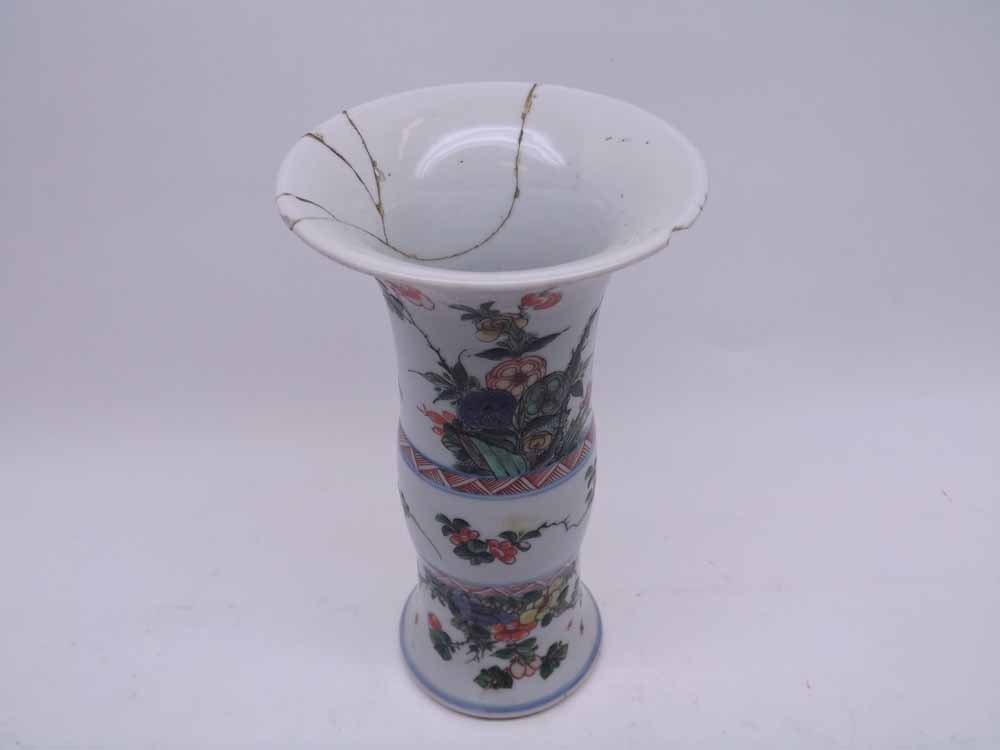 A Chinese Trumpet Vase, painted in colours with sprays of foliage, predominantly in iron red and