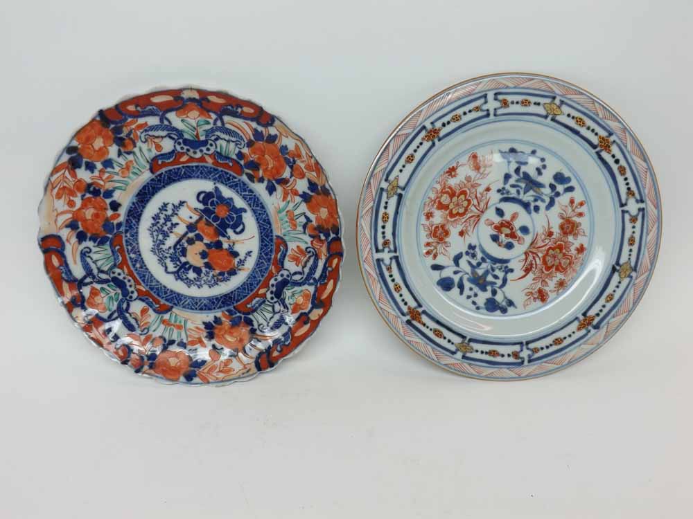 A Chinese circular Plate painted in iron red and underglaze blue within a compartmentalised border