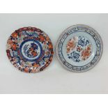 A Chinese circular Plate painted in iron red and underglaze blue within a compartmentalised border