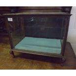 An early 20th Century Oak Framed Table Top Display Cabinet, glass top and sides and glass shelved