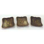 Set of three interesting early 20th Century Bronzed metal small dishes or ashtrays, decorated with
