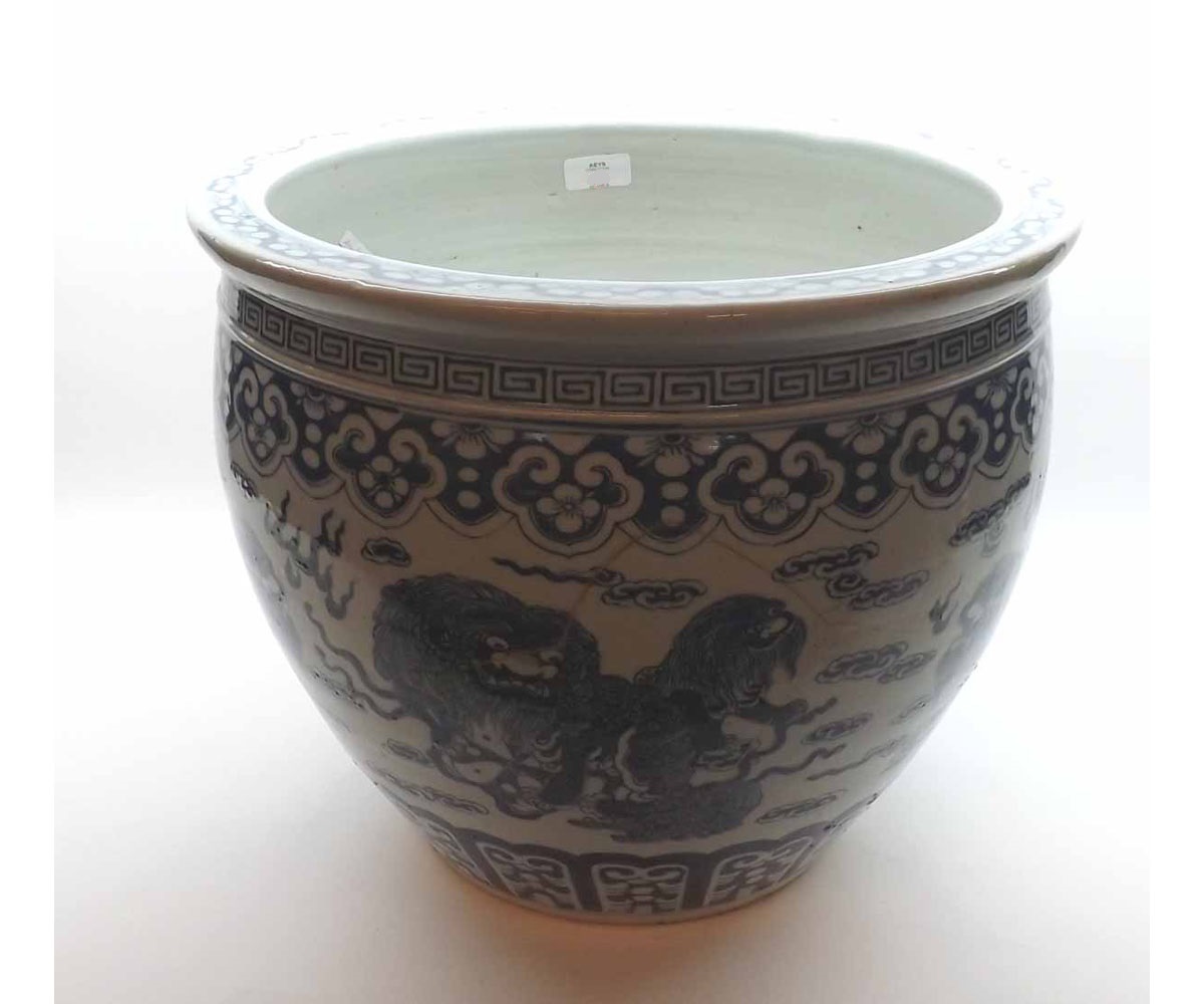 A Chinese large Jardiniere painted in underglaze blue with Kaolin, smoke clouds, within borders of