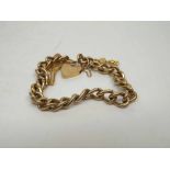 Hallmarked 9ct Gold curb link Bracelet with padlock and two further charm mounts, 27gms