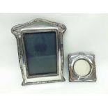An Edward VII Silver Mounted Photograph Frame of shaped rectangular form, with floral embossed
