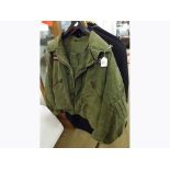 A vintage Government Issue Men's Lifeguard cold weather Jacket Mk 3, bomber style jacket in green